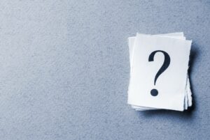 Single curled card with printed question mark